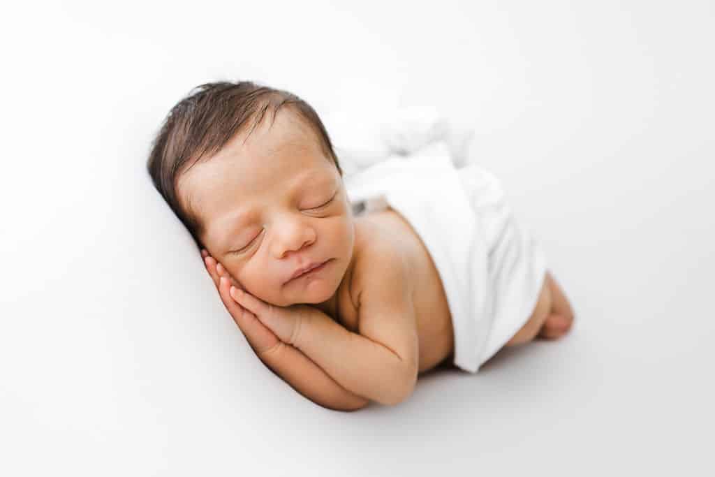 A newborn baby peacefully sleeping.