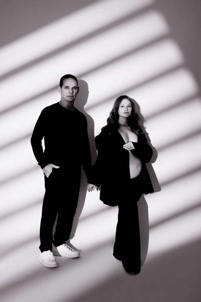 A black and white photo of a man and woman posing.