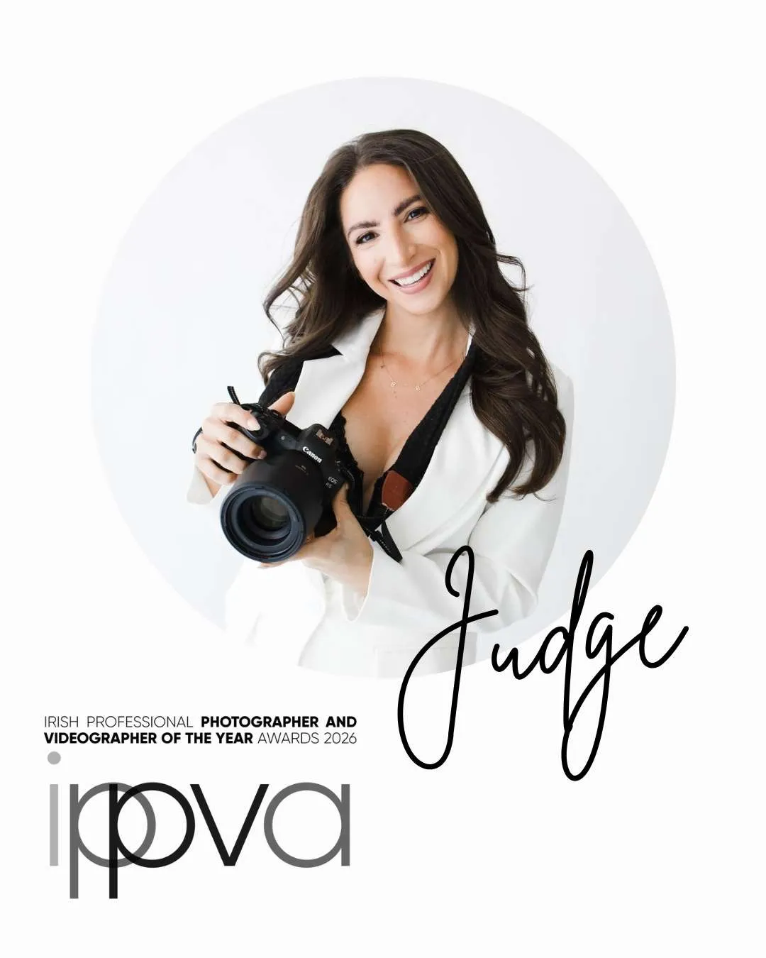 A smiling woman in a white blazer holds a camera. The words "Judge" and "IPVPA Photographer and Videographer of the Year Awards 2020" are displayed, highlighting her expertise as a Family Photographer Phoenix.